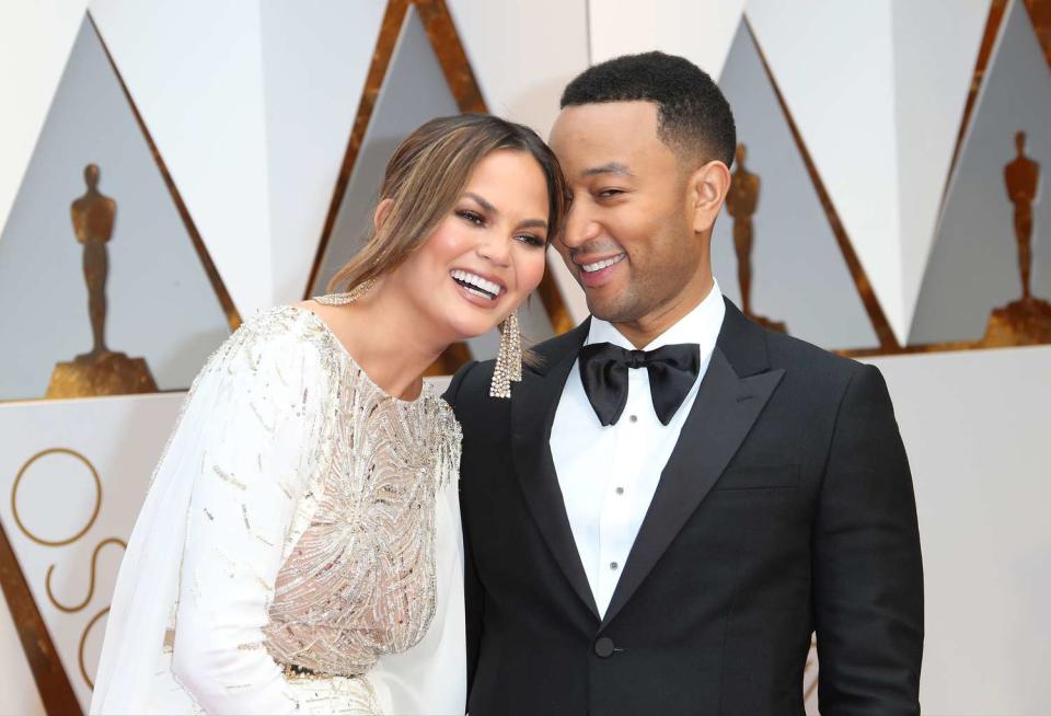 Model Chrissy Teigen (L) and musician John Legend arrive at the 89th Annual Academy Awards at Hollywood & Highland Center on February 26, 2017 in Hollywood, California