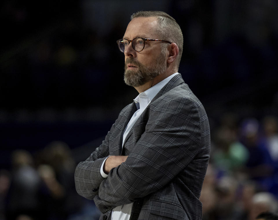 Keystone head coach Andrew Kettel watches his team during the first half of an NCAA college basketball game against James Madison in Harrisonburg, Va., Sunday, Dec. 3, 2023. (Daniel Lin/Daily News-Record via AP)