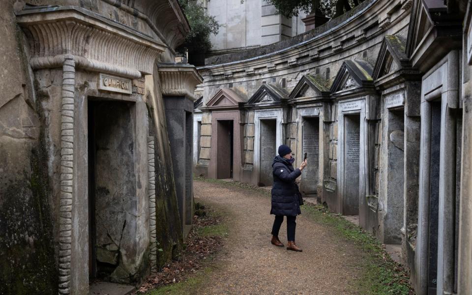 A tourist visits the Terrace Catacombs at Highgate