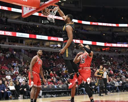 Jan 23, 2019; Chicago, IL, USA; Atlanta Hawks forward Omari Spellman (6) dunks the ball as Chicago Bulls forward Chandler Hutchison (15) stands nearby during the second half at United Center. Mandatory Credit: David Banks-USA TODAY Sports