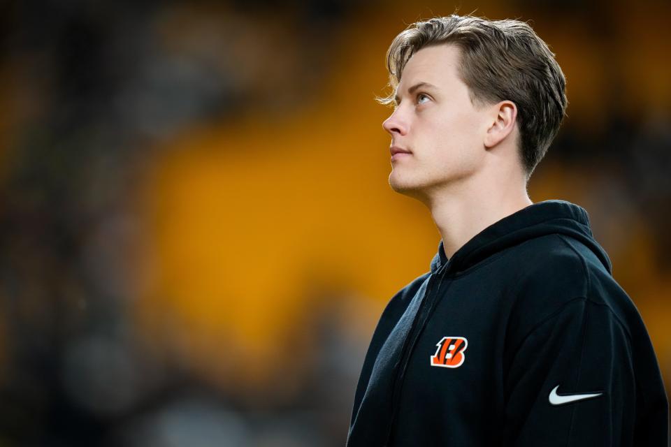 Injured Cincinnati Bengals quarterback Joe Burrow (9) heads to the locker room after the fourth quarter of the NFL 16 game between the Pittsburgh Steelers and the Cincinnati Bengals at Acrisure Stadium in Pittsburgh on Saturday, Dec. 23, 2023. The Steelers won 34-11.