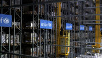 This image taken from video shows the inside of the UNICEF warehouse, the world's largest humanitarian aid warehouse, in Copenhagen, Denmark , Tuesday Oct. 13, 2020. For Burkina Faso, India, Venezuela and other countries with shaky health care delivery systems, the best chance for receiving scarce supplies of a coronavirus vaccine is through the Covax initiative, led by the World Health Organization and the Gavi vaccine alliance. UNICEF began laying the groundwork months ago in Copenhagen, at the world's largest humanitarian aid warehouse. (AP Photo)