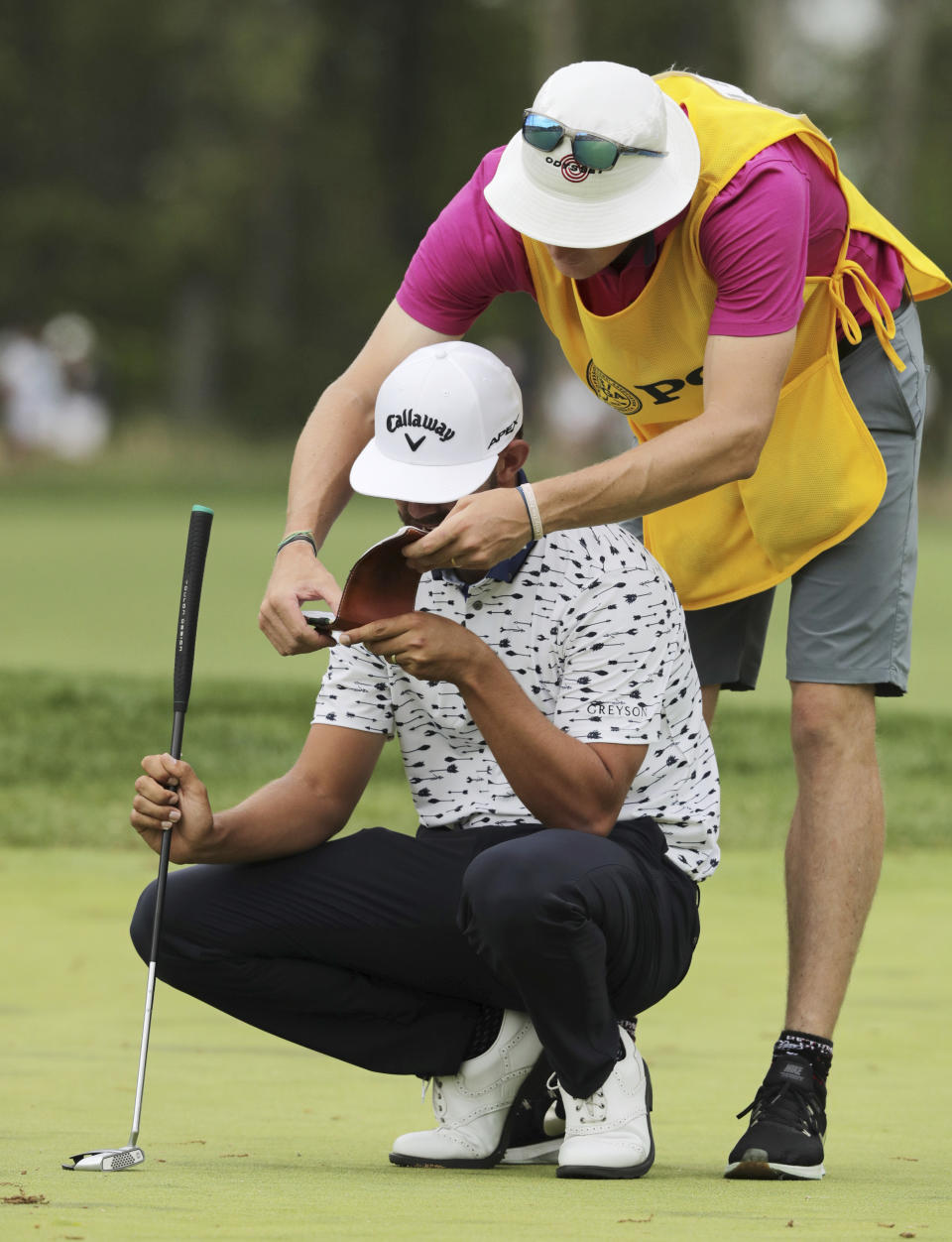 Erik Van Rooyen, of South Africa, checks his notes on the ninth green during the final round of the PGA Championship golf tournament, Sunday, May 19, 2019, at Bethpage Black in Farmingdale, N.Y. (AP Photo/Charles Krupa)