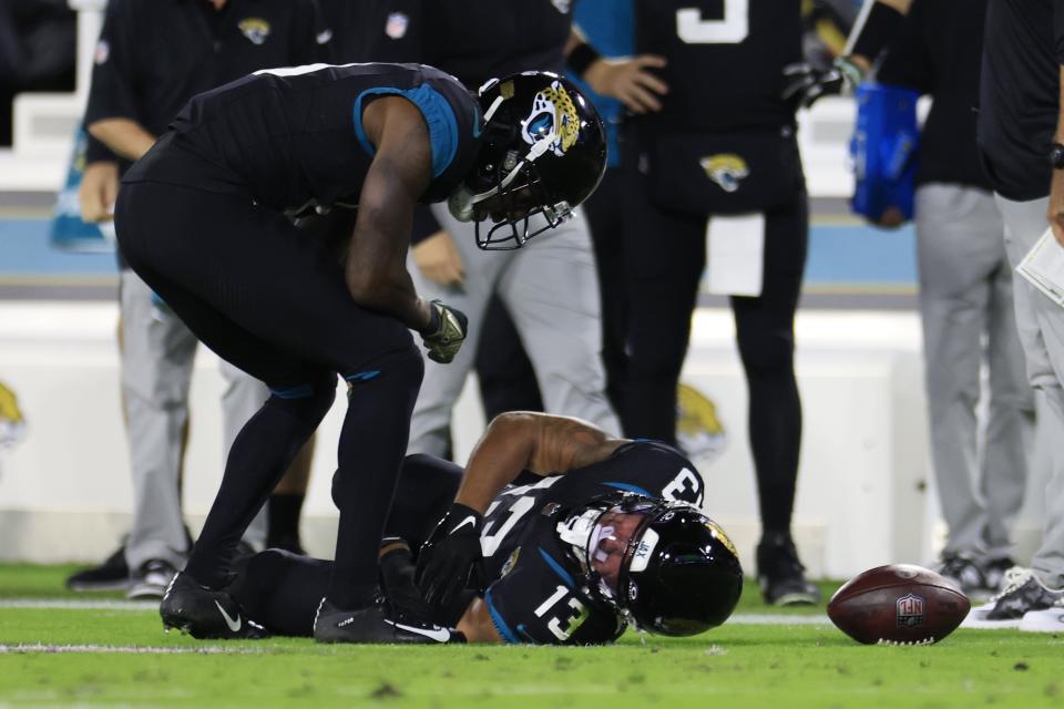 Jacksonville Jaguars wide receiver Christian Kirk (13) lies on the turf after an apparent injury that knocked him out of the game during the first quarter of a regular season NFL football matchup Monday, Dec. 4, 2023 at EverBank Stadium in Jacksonville, Fla. [Corey Perrine/Florida Times-Union]