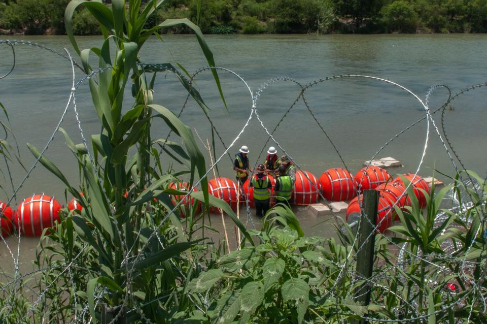 An image shared on Twitter by Texas Gov. Greg Abbott shows a marine barrier being installed along the Rio Grande in Eagle Pass, Texas, as part of the governor's ongoing effort to stem illegal immigration.