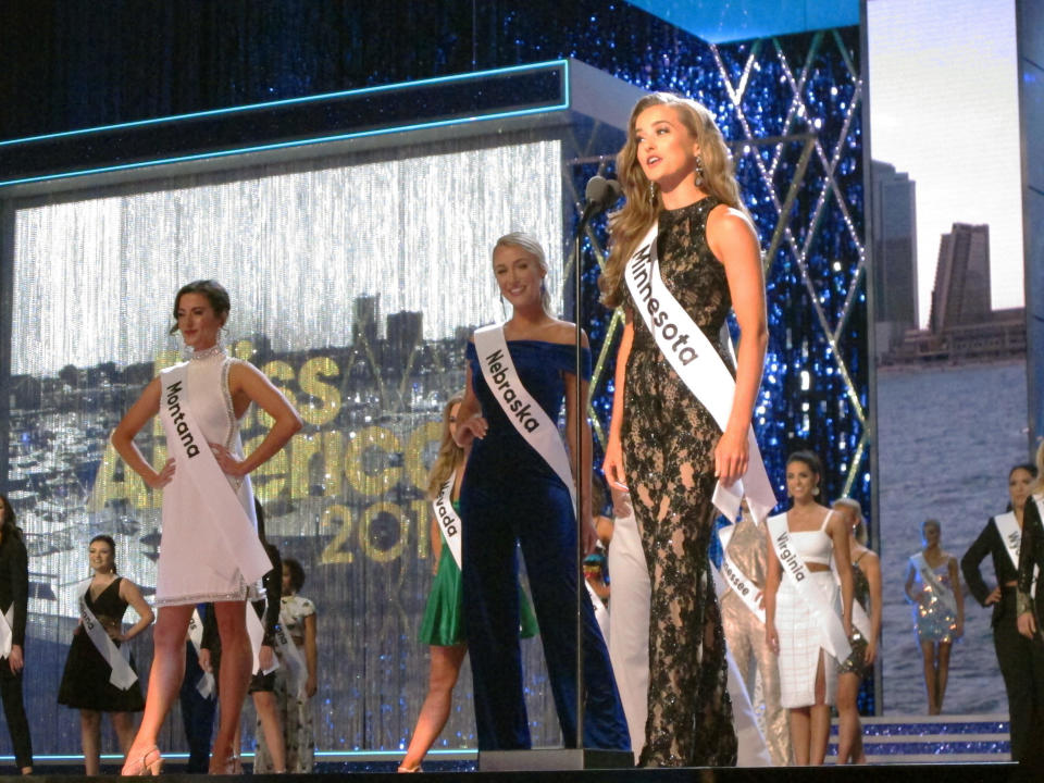 Miss Minnesota Michaelene Karlen introduces herself at the start of the third and final night of preliminary competition at the Miss America competition in Atlantic City N.J. on Friday Sept. 7, 2018. (AP Photo/Wayne Parry)