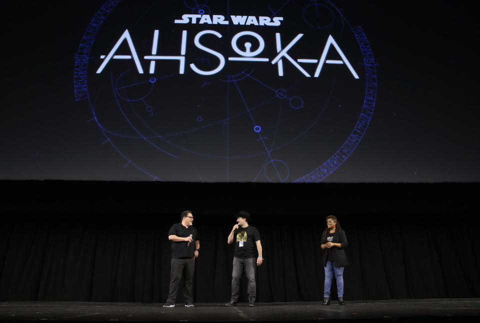 Jon Favreau and Dave Filoni discuss the upcoming Disney+ series “Ahsoka” with Lucasfilm panel host Yvette Nicole Brown at Star Wars Celebration. - Credit: Jesse Grant/Getty Images for Disney