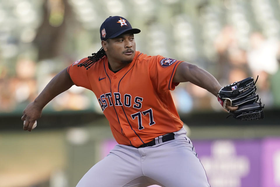 Houston Astros' Luis Garcia pitches against the Oakland Athletics during the first inning of a baseball game in Oakland, Calif., Tuesday, July 26, 2022. (AP Photo/Jeff Chiu)