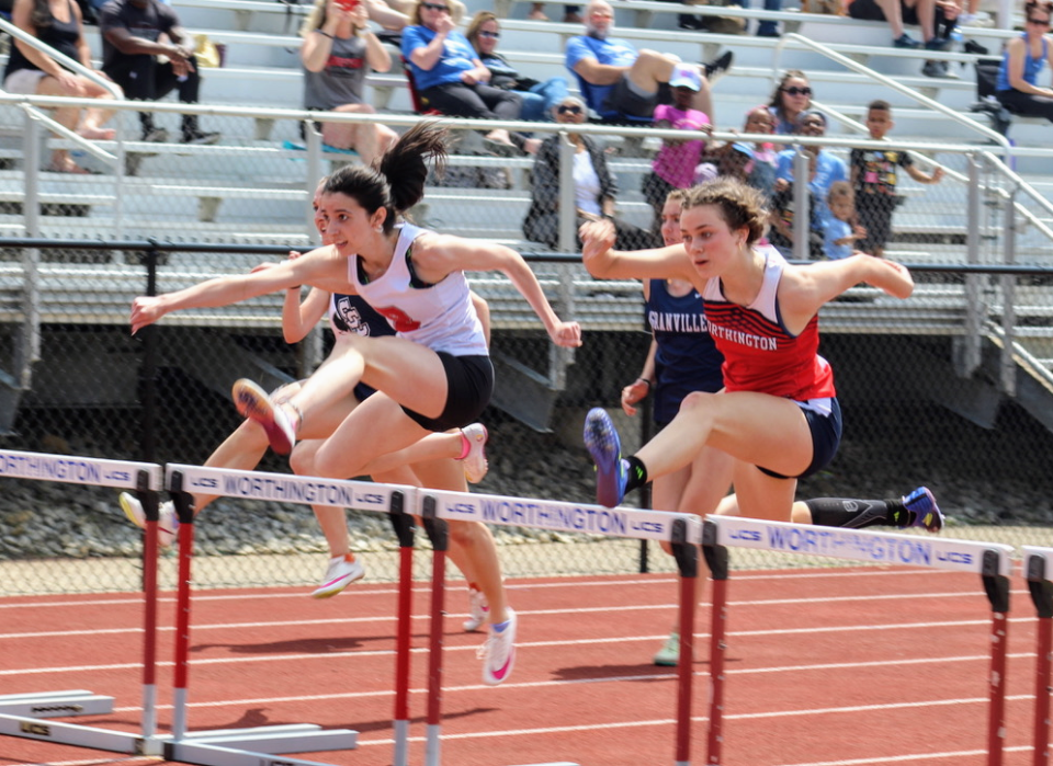 Thomas Worthington freshman Kira Luca, right, competes in the 100-meter hurdles in the Gary Smith Invitational on Saturday at Thomas. Luca finished third (15.78).