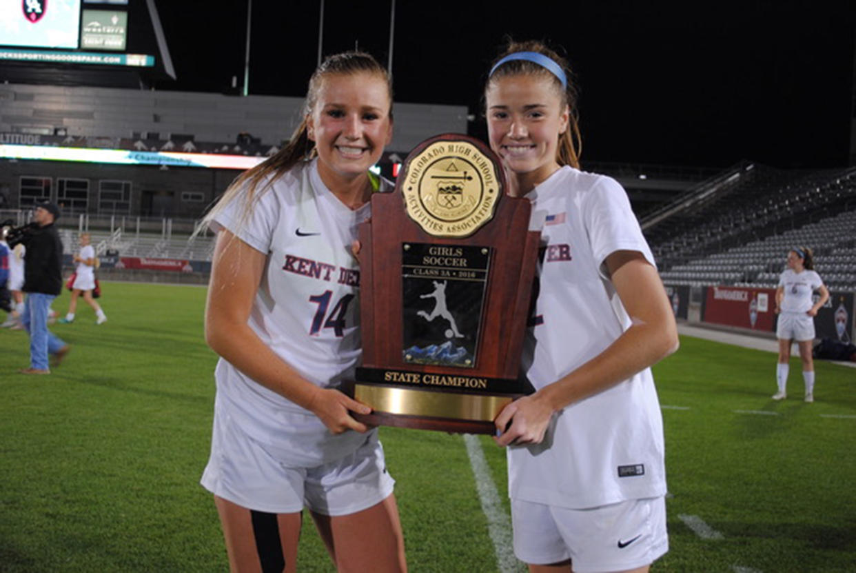 Maddie, right, and her sister Emma win a state soccer championship. (Courtesy Billings family)