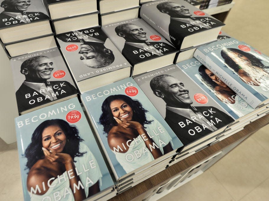Barack and Michelle Obama's memoirs side by side in a bookstore