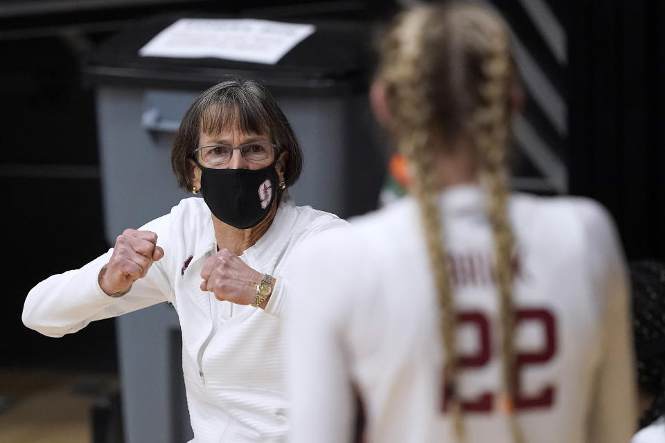 Stanford head coach Tara VanDerveer talks with her players during a time-out against Cal Poly in the second half of an NCAA college basketball game in Stanford, Calif., Wednesday, Nov. 25, 2020. (AP Photo/Tony Avelar)