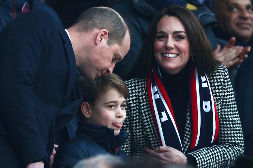 Britain&#39;s Prince William, Duke of Cambridge, (L), Britain&#39;s Prince George of Cambridge (C) and Britain&#39;s Catherine, Duchess of Cambridge, (R) attend the Six Nations international rugby union match between England and Wales at Twickenham Stadium, west London, on February 26, 2022.