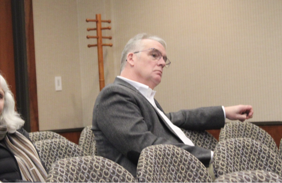 Former Charlevoix Police Chief Gerard Doan watches from the audience as candidates are interviewed for the position he resigned from last fall. Doan stepped-down amid an investigation into alleged sexual misconduct on his part.