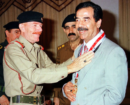 Iraq's vice-Chairman of the Revolution Command Council, Ezzat Ibrahim al-Douri, gives an award to President Saddam Hussein (R) in Baghdad in an undated file photo. REUTERS/Stringer/files