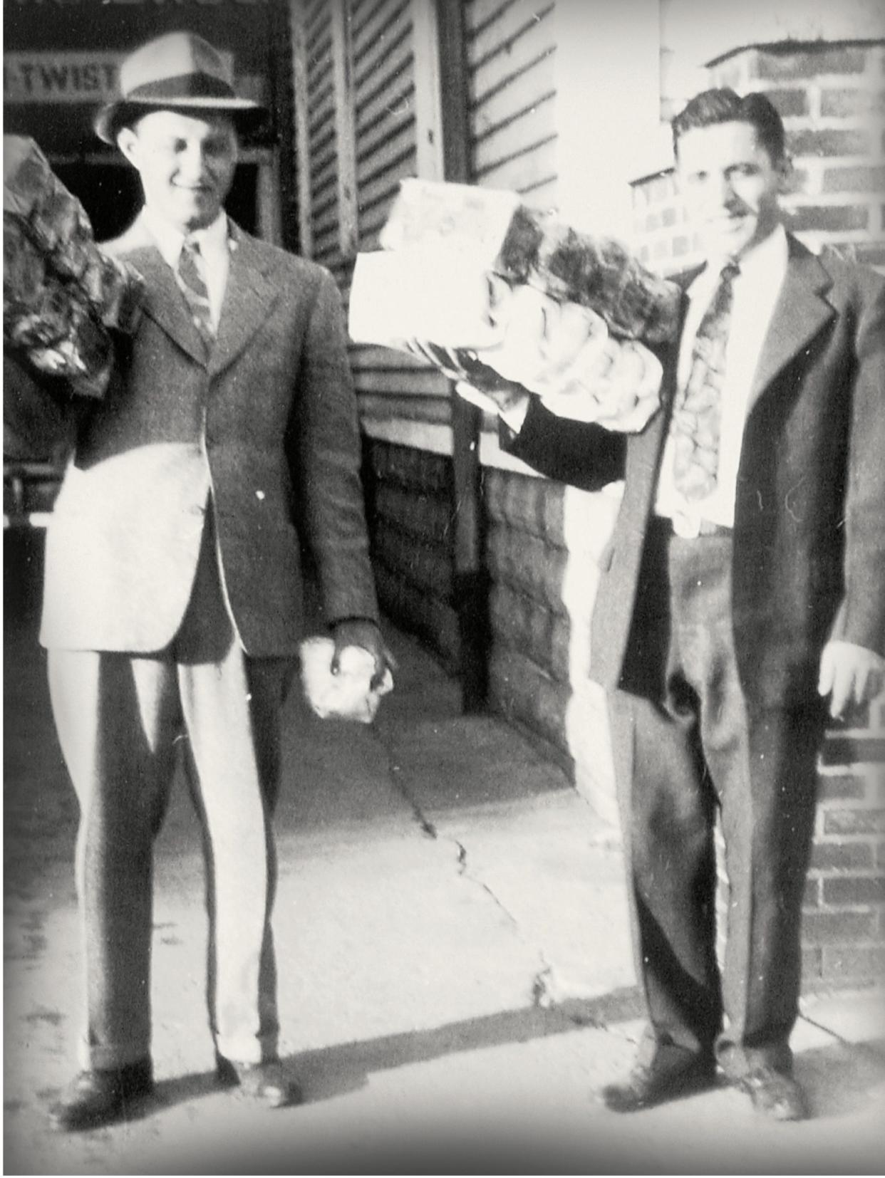 An archival photo from the early days of DeIorio's: Pasquale "Pat" DeIorio, left, and Giovanni "John" DeIorio hold loaves of bagged Italian bread.