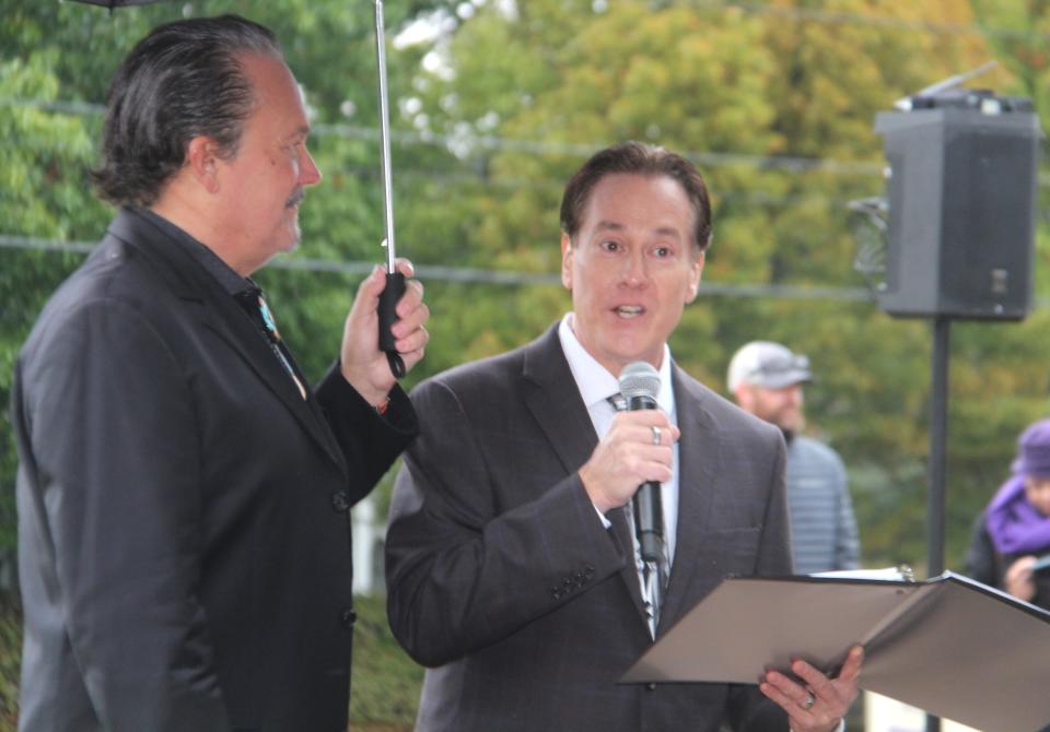 Timothy Russell "Russ" Tallchief, right, master of ceremonies, addresses the crowd at the unveiling of the new Marjorie Tallchief statue in Tulsa on Oct. 29. It was a rainy, cold afternoon.