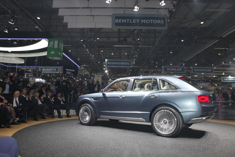 After months of rumors, Bentley revealed today a concept for its first sport utility vehicle ever: the 600-hp Bentley EXP 9 F. When it comes to vehicles for the wealthiest people in the world, restraint is so last century. With ultra-luxury vehicle sales rising on strong demand from China and the Middle East, the SUV would make the most financial sense as an addition. Given that the Continental starts around $190,000 and the Mulsanne around $280,000, it's easy to imagine a Bentley SUV with a sticker of about $250,000. Powered by a twin-turbo W-12 capable of 600 hp and 590 ft-lbs. of torque, Bentley says the EXP 9 would rank among the fastest vehicles of its kind. All that motive force gets to the ground through an 8-speed transmission and all-wheel-drive system turning 23-inch chrome wheels that are as bling-y as anything from Tire Rack. Inside lies the usual assortment of hand-stitched leathers, wood veneers and one-percentery touches like a split tailgate that folds down to reveal a custom dining set.