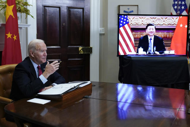 FILE - President Joe Biden meets virtually with Chinese President Xi Jinping from the Roosevelt Room of the White House in Washington, on Nov. 15, 2021. Biden's administration is taking stock of a newly empowered Xi Jinping as the Chinese president begins a third, norm-breaking five-year term as Communist Party leader. With U.S.-Chinese relations already fraught, concerns are growing in Washington that more difficult days may still lay ahead. (AP Photo/Susan Walsh, File)