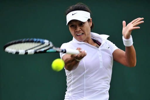 China's Li Na plays a shot during the loss in her second round women's singles match against Romania's Sorana Cirstea on day three of the 2012 Wimbledon Championships tennis tournament at the All England Tennis Club in Wimbledon, southwest London. Li's Grand Slam slump worsened as she tumbled out of the Wimbledon second round with a 6-3, 6-4 defeat