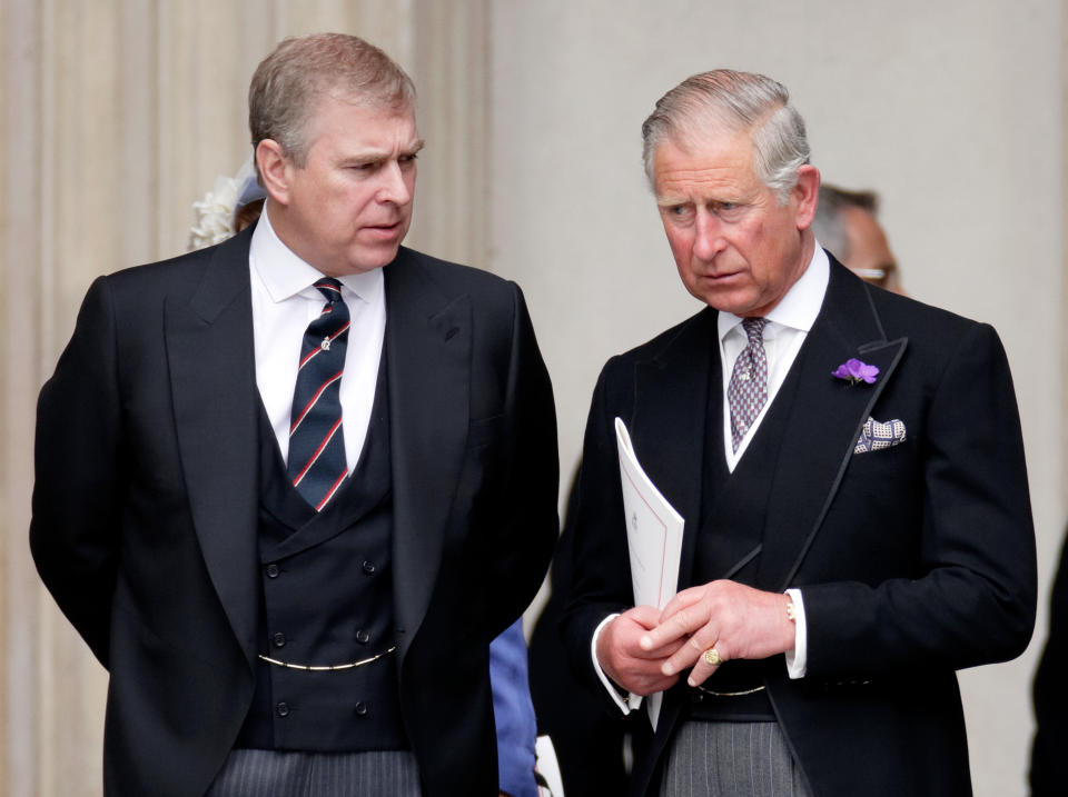 Prince Andrew and Prince Charles talking