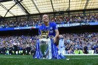 <p>John Terry poses with the Premier League trophy after his final game as a Chelsea player</p>