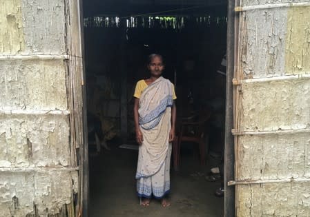 FILE PHOTO: Madhubala Mandal poses for a photograph inside her bamboo hut in Bishnupur village