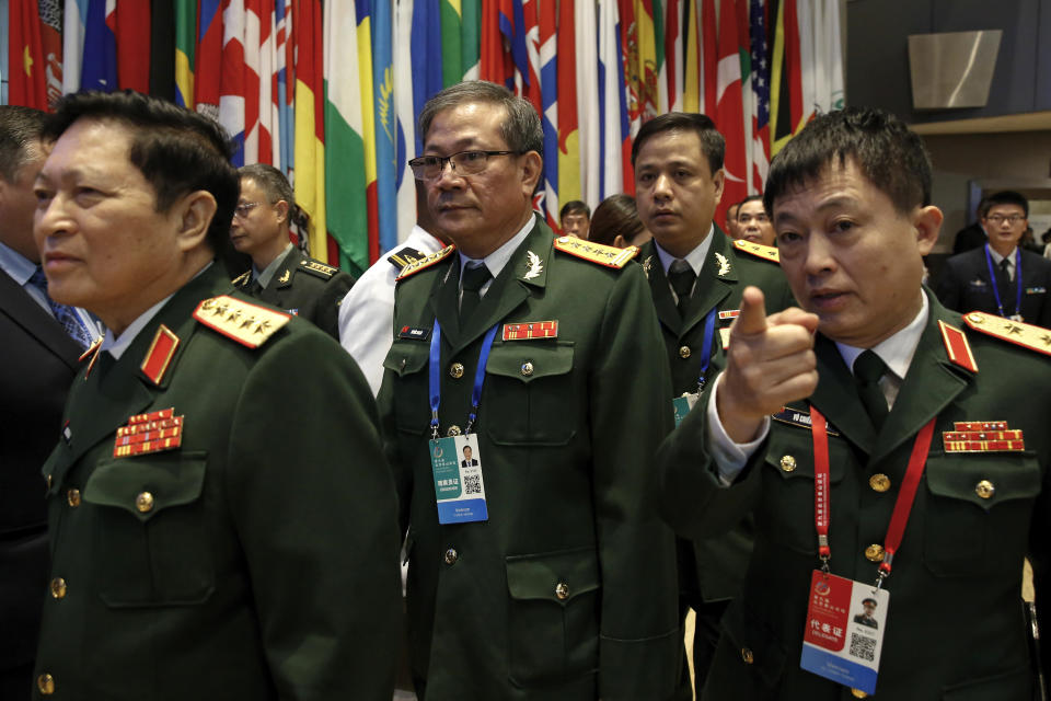 Members of Vietnam military delegation arrive at the Xiangshan Forum, a gathering of the region's security officials, in Beijing, Monday, Oct. 21, 2019. Vietnam has pulled the animated feature "Abominable" from theaters because the U.S.-Chinese-made movie showed a map supporting Chinese claims to the disputed South China Sea. (AP Photo/Andy Wong)