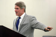 Defense Attorney Jimmy Turk points towards his client during closing statements in former Virginia Tech football player Isimemen David Etute's trial in Montgomery County Circuit Court in Christiansburg, Va., Friday May 27 2022. Etute is accused of fatally beating Jerry Smith, 40 in May 2021, a man he met on an online dating site and had initially believed to be a woman. (Matt Gentry/The Roanoke Times via AP)