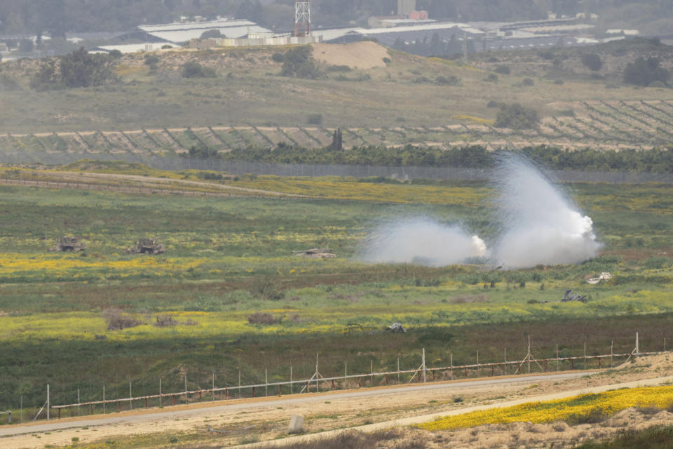 An Israeli tank, center, moves near the Israeli-Gaza border as seen from southern Israel, Monday, March 18, 2024. (AP Photo/Ohad Zwigenberg)