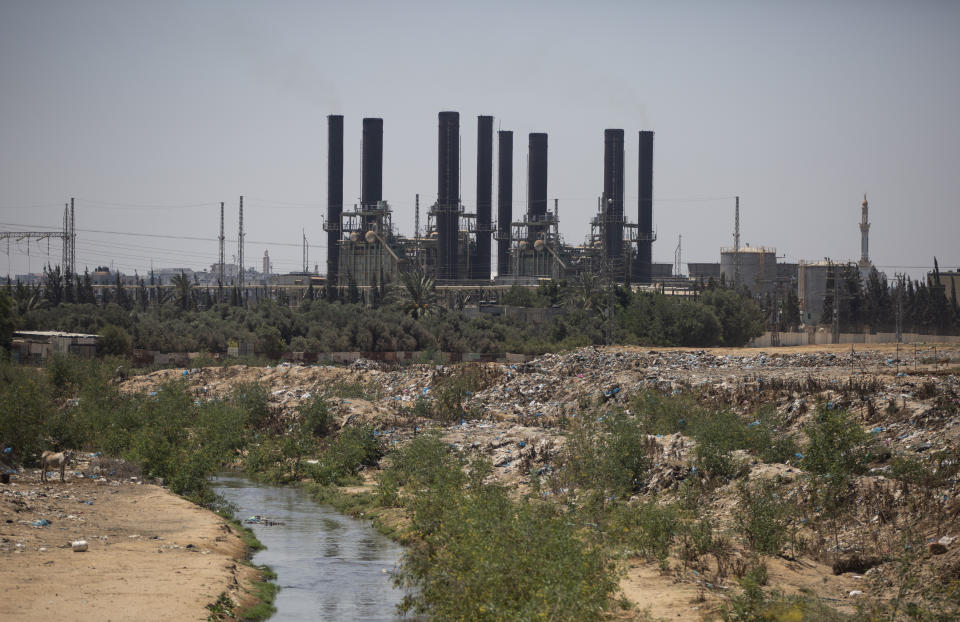 FILE - The Nusseirat power plant, is seen in the central Gaza Strip, Monday, June 28, 2021. Gaza's Hamas rulers have reached an agreement by which Qatar will resume subsidizing the salaries of public employees by sending fuel to the impoverished territory, a Hamas official said Tuesday, Nov. 30. (AP Photo/Khalil Hamra, File)