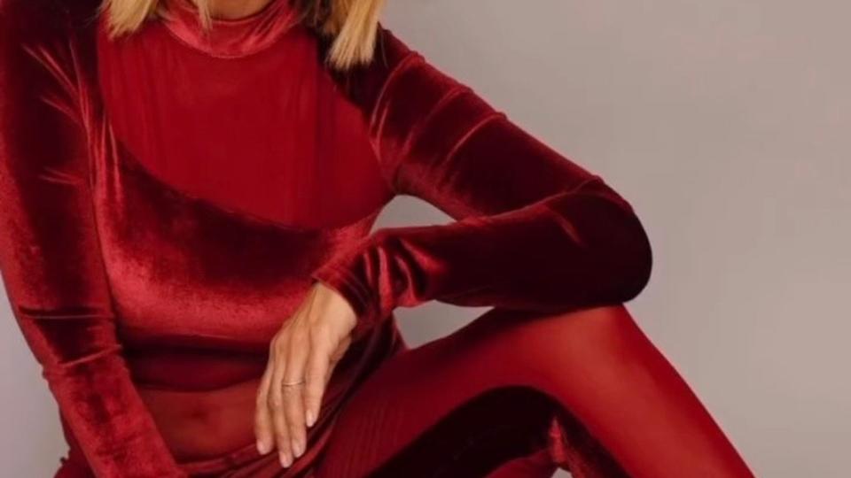 Louise Redknapp wearing a red bodysuit