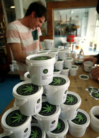 Plastic containers with cannabis are displayed at Dr Green shop in Lausanne, Switzerland March 17, 2017. REUTERS/Denis Balibouse