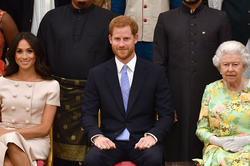 Harry and Meghan with the late Queen