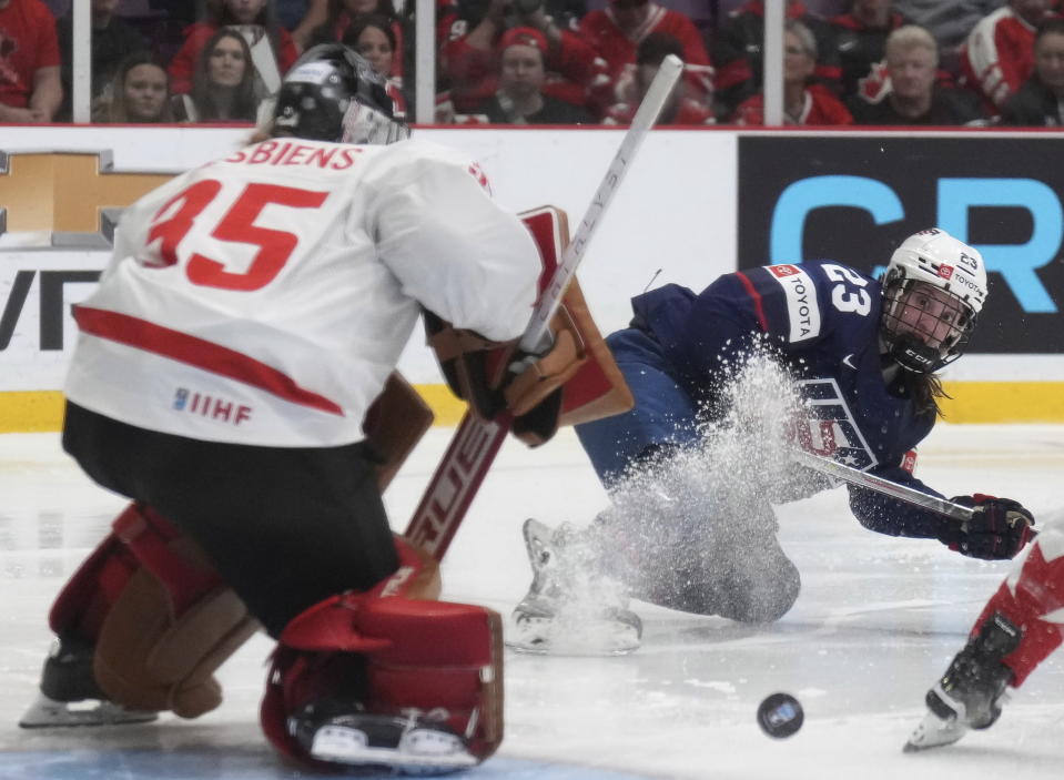 United States forward Hannah Bilka (23) looks on as the puck goes wide of Canada goaltender Ann-Renee Desbiens's net during the second period of the gold medal game at women's world hockey championships in Brampton, Ontario, Sunday, April 16, 2023. (Nathan Denette/The Canadian Press via AP)