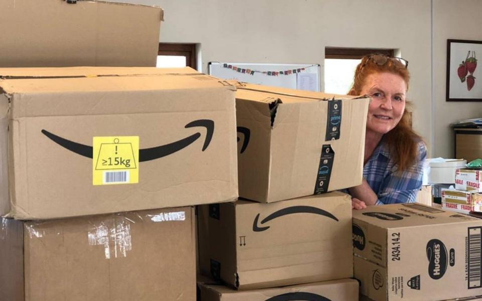 Sarah Ferguson poses with some of the care parcels - TMG