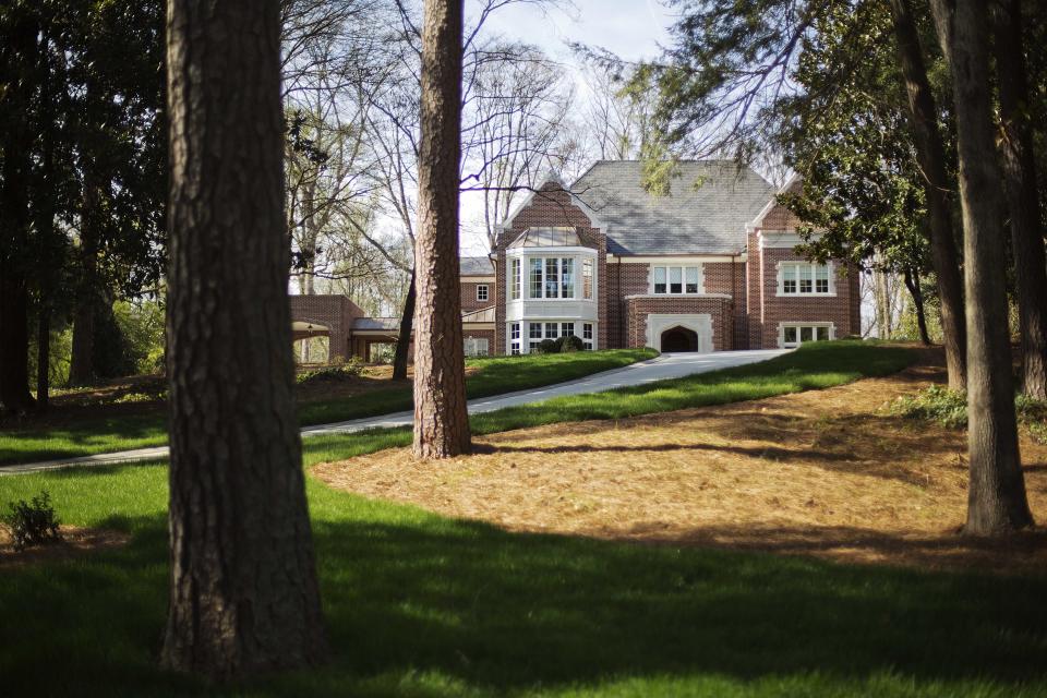 In this March 31, 2014, photo the new $2.2 million mansion that is the residence of Atlanta Archbishop Wilton Gregory stands in the upscale Buckhead neighborhood in Atlanta. Gregory apologized for his spending and offered to put the home up for sale after Pope Francis permanently removed a German bishop for his lavish spending on a renovation project. (AP Photo/David Goldman)