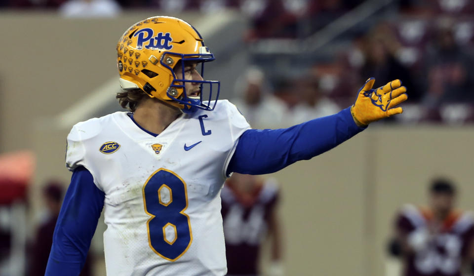 Pittsburgh quarterback Kenny Pickett (8) signals a first down during a fourth quarter drive of an NCAA college football game against Virginia Tech, Saturday, Oct. 16, 2021, in Blacksburg, Va. (Matt Gentry/The Roanoke Times via AP)