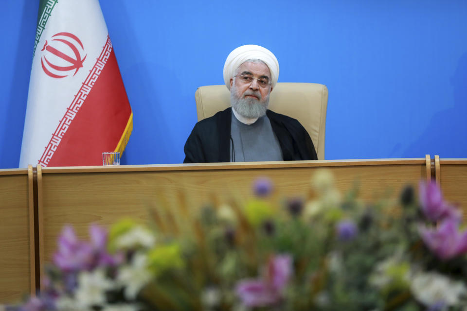 In this photo released by the official website of the office of the Iranian Presidency, President Hassan Rouhani attends a meeting with the Health Ministry officials, in Tehran, Iran, Tuesday, June 25, 2019. Rouhani said the new U.S. sanctions targeting the Islamic Republic's supreme leader and others are "outrageous and idiotic." The comments by Hassan Rouhani come a day after the Trump administration sanctioned Supreme Leader Ayatollah Ali Khamenei and his associates. (Iranian Presidency Office via AP)