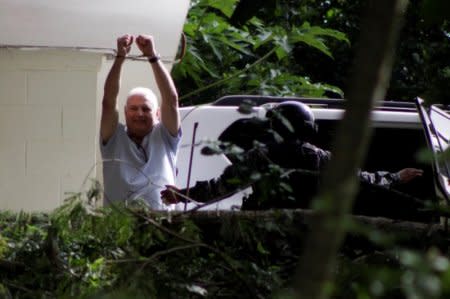 FILE PHOTO: Former Panama president Ricardo Martinelli gestures toward media at Renacer prison in Panama City, Panama June 11, 2018. REUTERS/Carlos Lemos