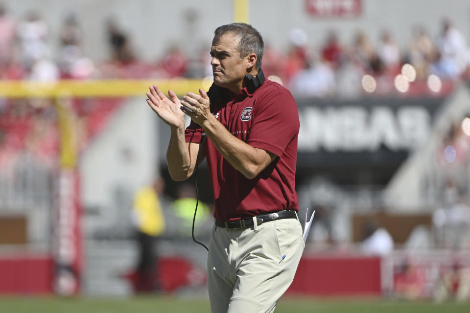 FILE - South Carolina coach Shane Beamer goes out to talk to his team during a time out against Arkansas during the first half of an NCAA college football game Saturday, Sept. 10, 2022, in Fayetteville, Ark. No. 19 Notre Dame faces 20th-ranked South Carolina in the Gator Bowl. (AP Photo/Michael Woods, File)