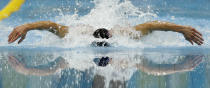 United States' Michael Phelps competes in the men's 100-meter butterfly swimming semifinal at the Aquatics Centre in the Olympic Park during the 2012 Summer Olympics in London, Thursday, Aug. 2, 2012. (AP Photo/Michael Sohn)