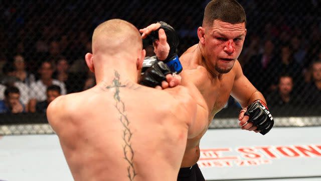 Diaz throws a punch at McGregor. Pic: Getty