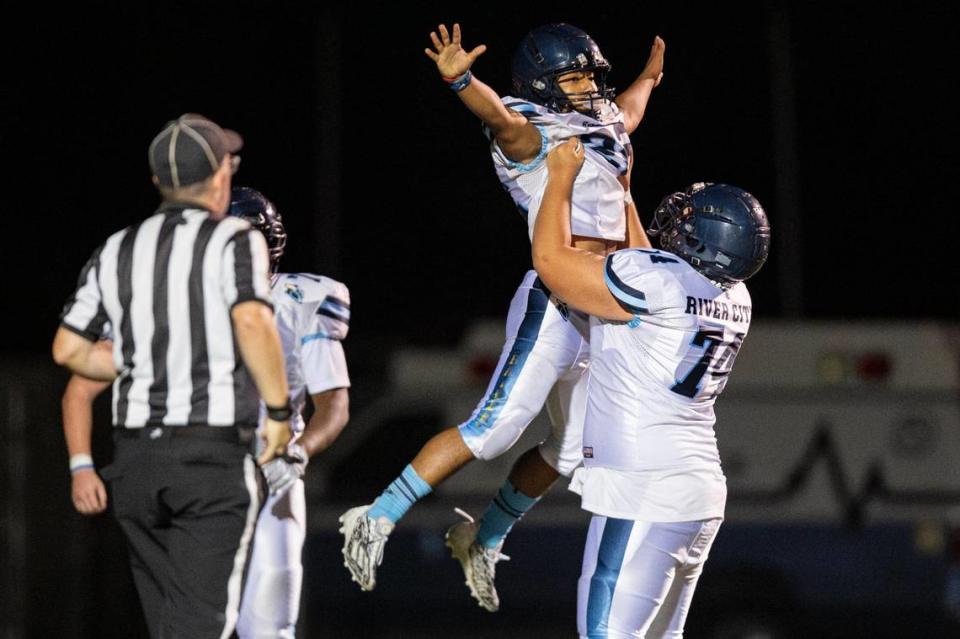 River City Raiders running back Amari Swilley (22) celebrates with center Cody Darosa (74) after scoring a touchdown during the second half of the game at Del Campo High School on Friday, Sept. 1, 2023, in Fair Oaks.