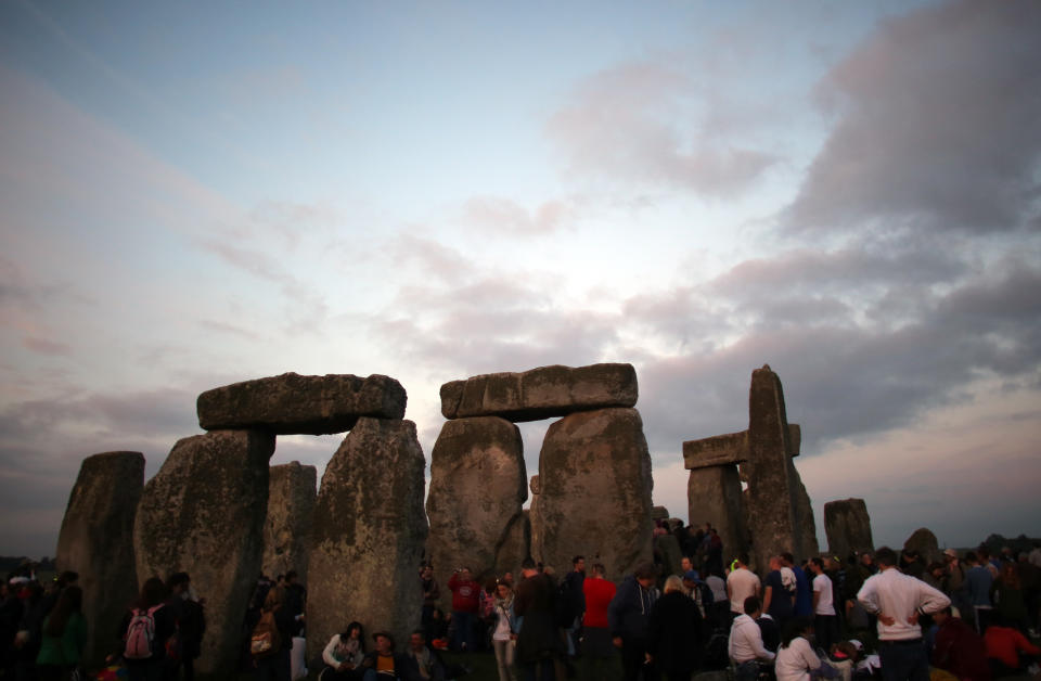 AMESBURY, ENGLAND - JUNE 20:  Revellers gather to celebrate the arrival of the midsummer dawn at the megalithic monument of Stonehenge on June 20, 2013 near Amesbury, England.  (Photo by Matt Cardy/Getty Images)