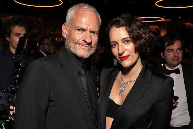 <p>Todd Williamson/NBC via Getty</p> Martin McDonagh and Phoebe Waller-Bridge at the 2023 Golden Globe Awards.