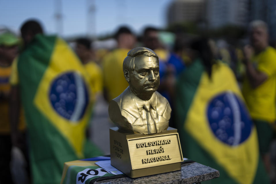 A statue depicting President Jair Bolsonaro and labeled as a national hero, sits on a podium during the country's Independence Day celebrations, on Copacabana Beach in Rio de Janeiro, Brazil, Wednesday, Sept. 7, 2022. Bolsonaro is waging an all-out campaign to shore up the crucial evangelical vote. (AP Photo/Rodrigo Abd)