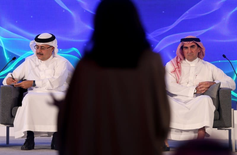 Amin H. Nasser, president and CEO of Saudi Aramco, and Yasser al-Rumayyan, Aramco's chairman, listen to a journalist's question during a news conference in Dhahran