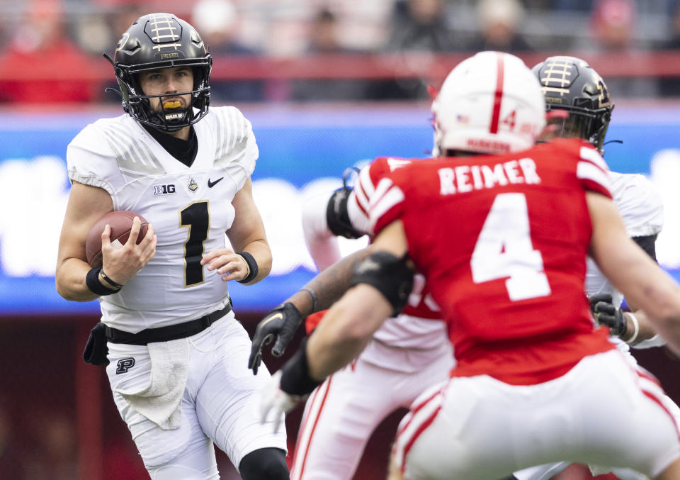 Purdue quarterback Hudson Card (1) carries the ball against Nebraska during the first half of an NCAA college football game Saturday, Oct. 28, 2023, in Lincoln, Neb. (AP Photo/Rebecca S. Gratz)