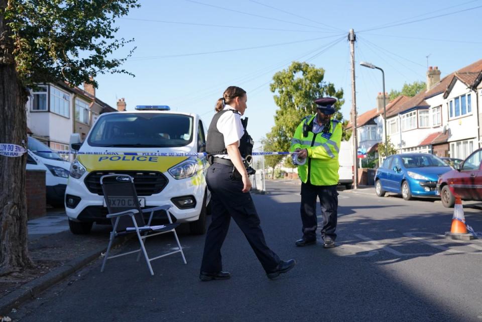 Police erects a cordon near the scene on Galpin’s Road, Merton, south London (Jonathan Brady/PA) (PA Wire)